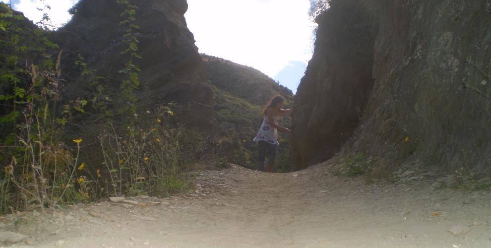 A nice carved track through rock at Arrow River, Arrowtown. Massive cliff to the left of the picture.